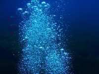 1024623_Bubbles-of-diving-trip-against-black-bottom.-Underwater-shot-