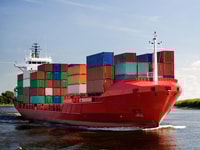 1028225_cargo-container-ship-freighter-navigating-river-Distribution