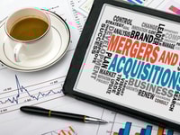 1031800_mergersandacquisitionsconceptwithbusinesswordcloudhandwrittenontabletpc_57802