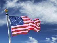 1032119_usa.windblownflagoftheunitedstatesofamericaoverskybackground._71541