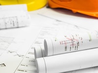 Compliance-Architectural-blueprint-of-office-building-with-a-pencils