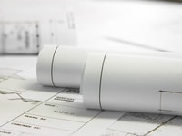 Compliance-Architectural-blueprint-of-office-building-with-a-pencils