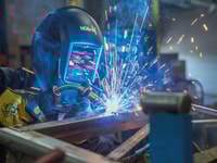 man welding