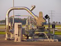 Modern natural gas well detail during sunset