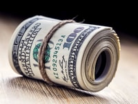 Close-up rolled American dollars banknotes_555861163