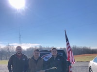 Harris reps Patrick Kelley, left, and Same Koehne, right, with Jimmy Nessler of Mako Industries