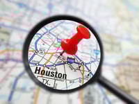 Houston, Texas map with red pin and magnifying glass