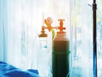 oxygen-tank-beside-patient-bed-in-hospital