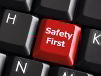 safety first concept with red key on computer keyboard