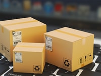 stock Internet shopping, online purchase, e-commerce and packages delivery concept, merchandise cardboard boxes on laptop keyboard_RGB PP