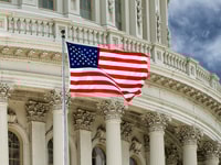 Washington DC Capitol dome detail with waving american flag