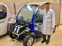 Xianguo Li with fuel cell test vehicle
