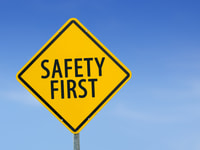 Yellow traffic sign-Safety First-on the sky background