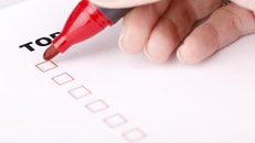 1021909_To-Do-list-with-check-marks-isolated-on-white-women-hand-with-red-marker