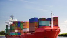 1028225_cargo-container-ship-freighter-navigating-river-Distribution