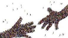 1031004_largegroupofpeopleseenfromabovegatheredtogetherintheshapeoftwohandsreachingouteachother_463515