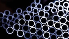 Metals-stack-of-steel-pipes-with-blue-light