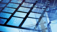 Spec-gases-Laboratory-Computer-keyboard-and-laboratory-glass-in-blue-light.-Science-concept