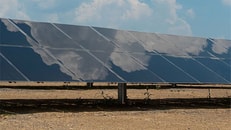 Clouds reflected in solar panel at Air Products