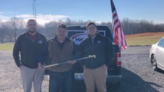 Harris reps Patrick Kelley, left, and Same Koehne, right, with Jimmy Nessler of Mako Industries