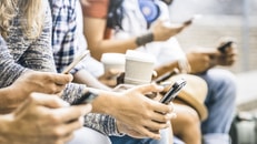 Multicultural friends group using smartphone with coffee at university college break - People hands addicted by mobile smart phone - Technology concept with connected trendy millennials