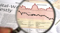 Newspaper magnifying on finance