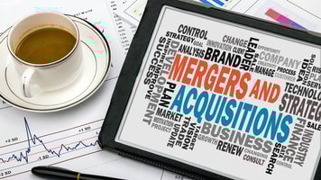 1031800_mergersandacquisitionsconceptwithbusinesswordcloudhandwrittenontabletpc_57802