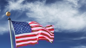 1032119_usa.windblownflagoftheunitedstatesofamericaoverskybackground._71541