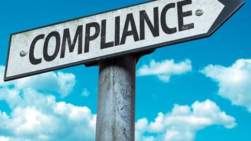 Compliance, sign with sky background