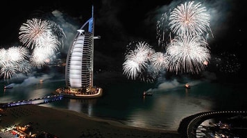 Fireworks light up the Burj Al Arab, from the Jumeirah Beach Hotel