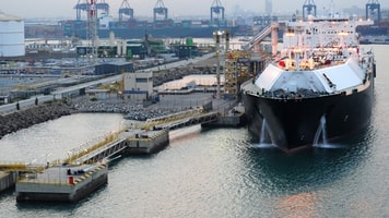 Liquefied natural gas LNG Tanker docked at Port