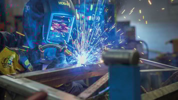 man welding