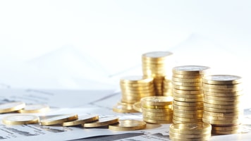 Business diagram on financial report with coins