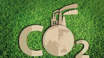 Carbon dioxide. Paper cut of eco on green grass
