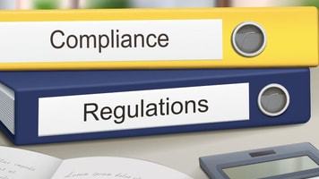 compliance and regulations binders isolated on the office table
