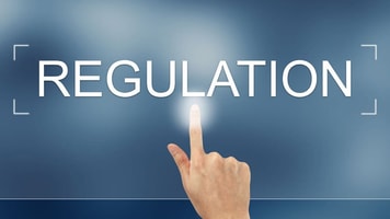 Compliance, hand press on regulation button on webpage