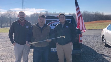 Harris reps Patrick Kelley, left, and Same Koehne, right, with Jimmy Nessler of Mako Industries