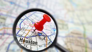 Houston, Texas map with red pin and magnifying glass