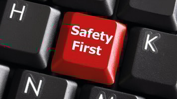 safety first concept with red key on computer keyboard