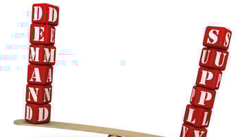 Supply outweighs demand. The surplus. The words SUPPLY and DEMAND (made from red cubes with letters) are weighed in the balance. The word SUPPLY outweighs the word DEMAND. Isolated. 3D Illustration_RGB