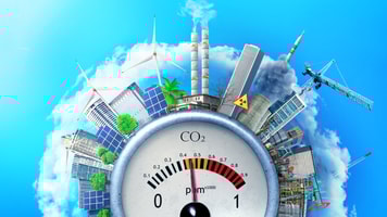 The concept of environmental pollution. City around a carbon dioxide sensor against a blue sky. The concept of safe energy