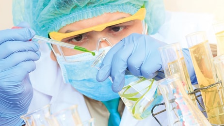 1026046_A-chemist-is-doing-his-chemical-lab-research-at-laboratory
