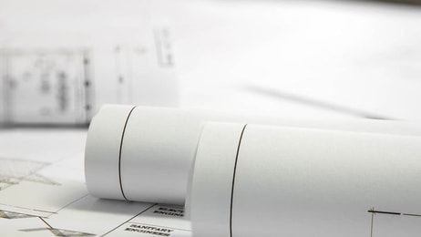 Compliance-Architectural-blueprint-of-office-building-with-a-pencils