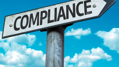 Compliance, sign with sky background