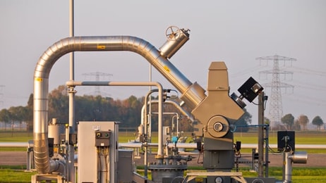 Modern natural gas well detail during sunset