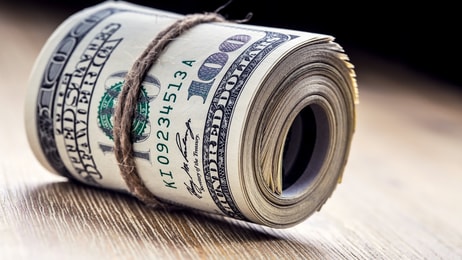 Close-up rolled American dollars banknotes_555861163