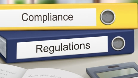 compliance and regulations binders isolated on the office table