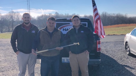 Harris reps Patrick Kelley, left, and Same Koehne, right, with Jimmy Nessler of Mako Industries