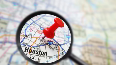 Houston, Texas map with red pin and magnifying glass