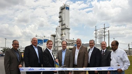 Linde executives and local officials cut the ribbon on the company